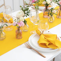 Geltonos spalvos stalo takelis ir servetėlės